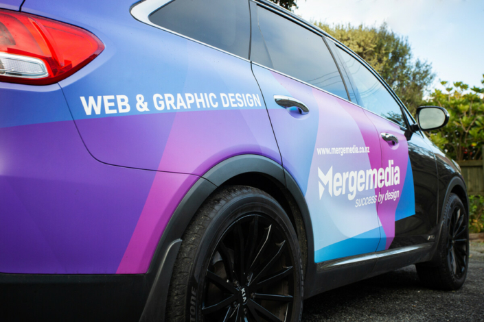 image of the signwriting on the Merge Media car