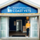 image of vet Christie standing outside the Pohutukawa Coast Vets clinic.