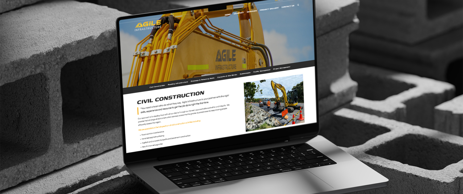 Agile Infrastructure website on Laptop on concrete blocks