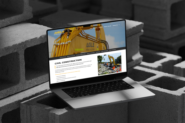 Agile Infrastructure website on Laptop on concrete blocks