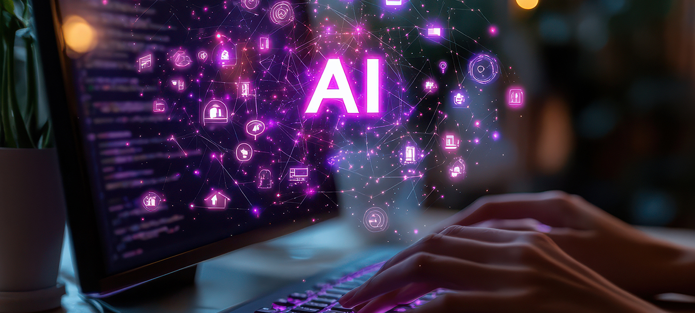 Person typing on keyboard with "ai" on the screen